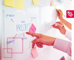 Quadro branco com postits, mostrando um processo de cocriação.